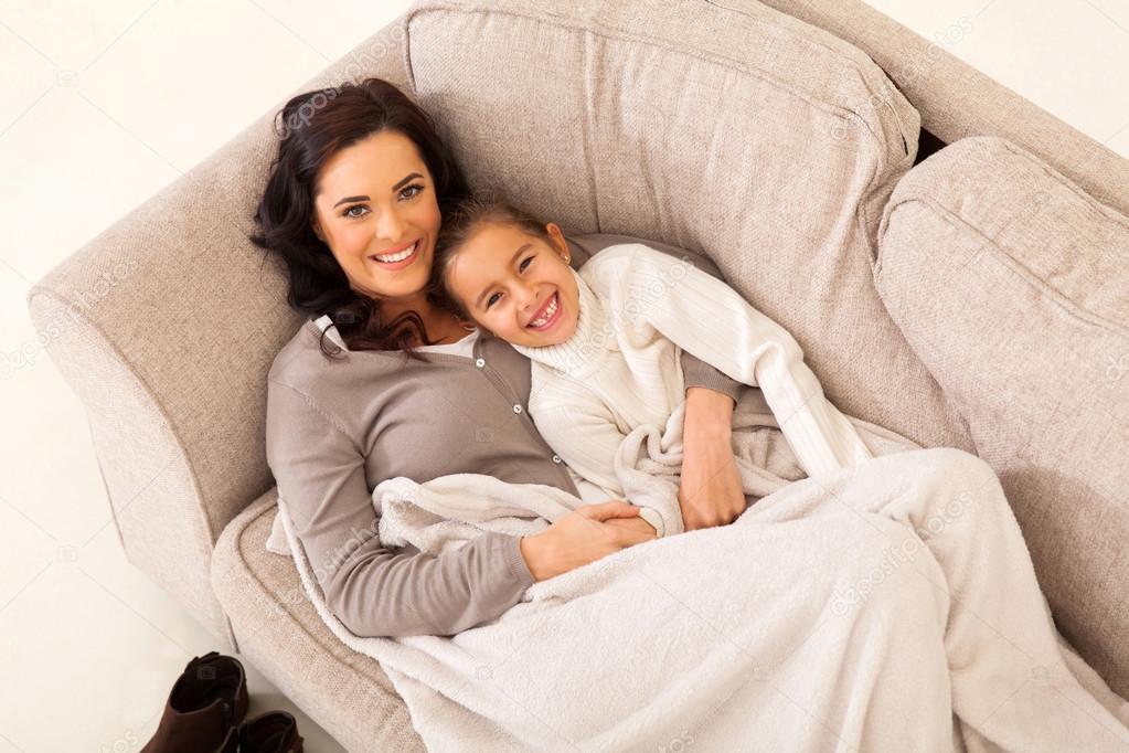 Girl and mother on the couch