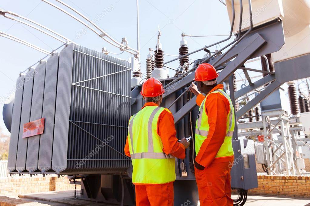 Electricians in electrical power plant