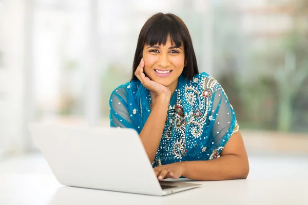 Businesswoman using laptop at home — Stock Photo, Image