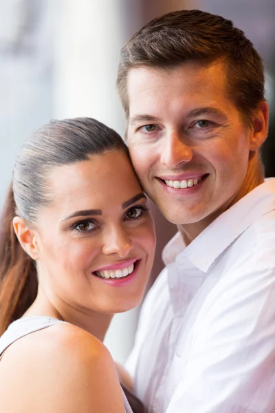 Couple hugging in lounge — Stock Photo, Image