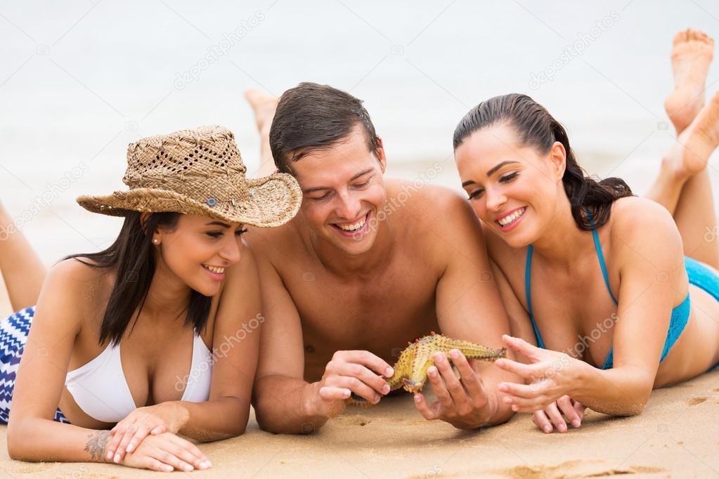 Friends holding starfish