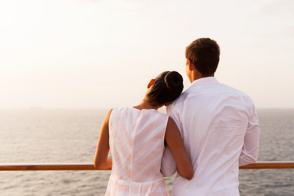 Couple standing on ship deck