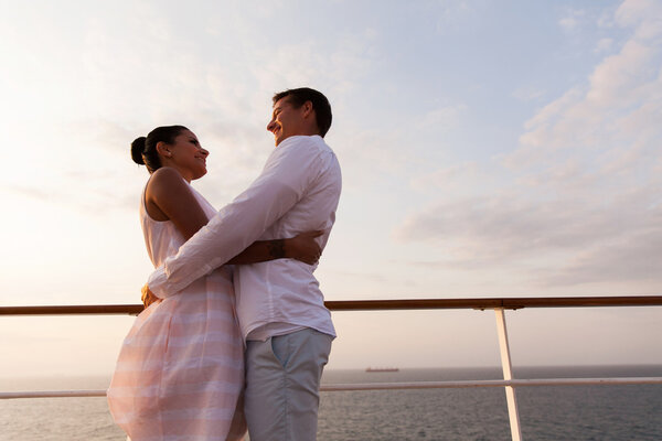 Couple embracing on cruise ship