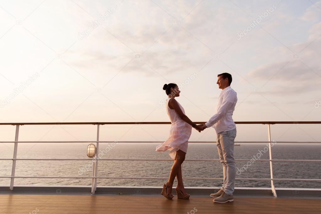 Couple holding hands on cruise