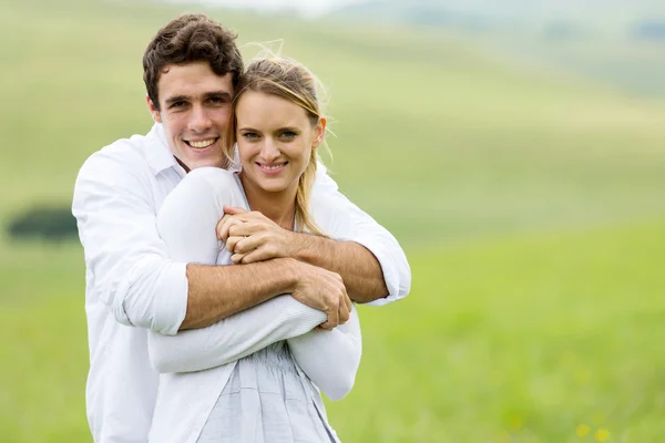 Young couple portrait on grassland Stock Picture