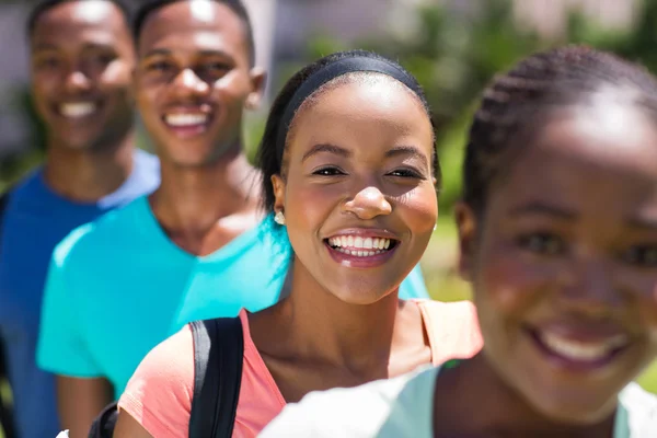 Female african university student with friends — Stock Photo, Image