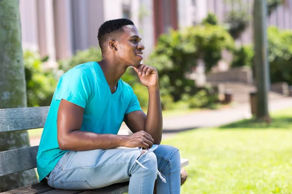 African college student daydreaming — Stock Photo, Image