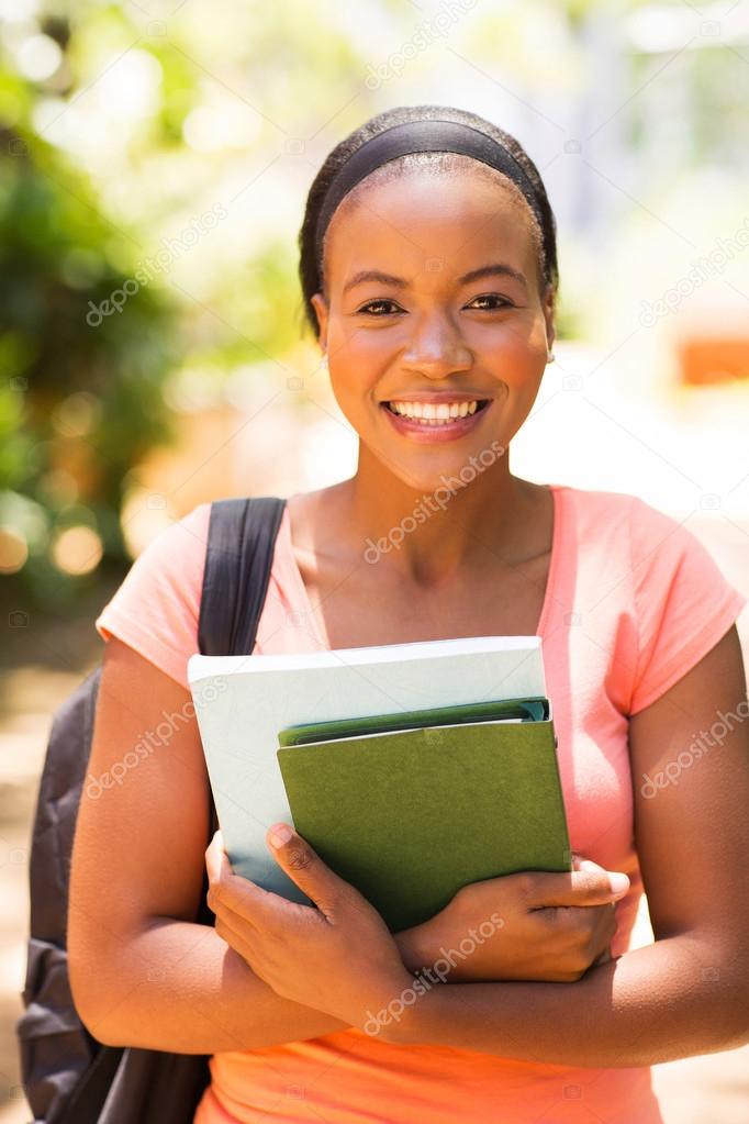 african university student holding books