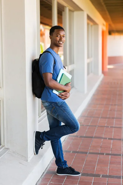 College student leaning against wall — Stock Photo, Image