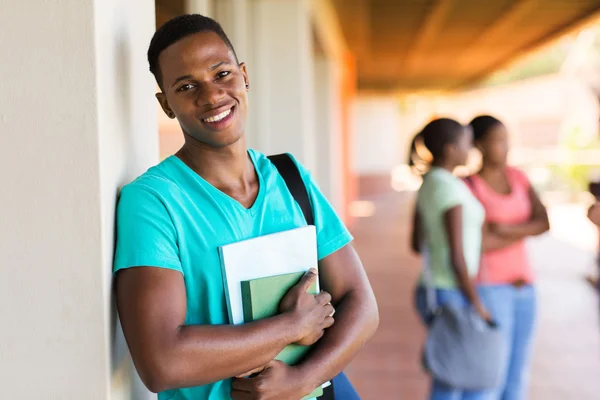 Negro estudiante universitario con libros —  Fotos de Stock