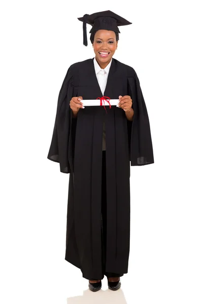 Female college graduate in gown and cap — Stock Photo, Image