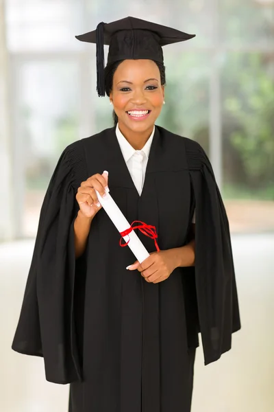 Young college graduate holding certificate — Stock Photo, Image