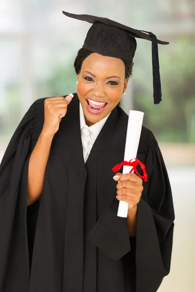 Female graduate holding diploma — Stock Photo, Image