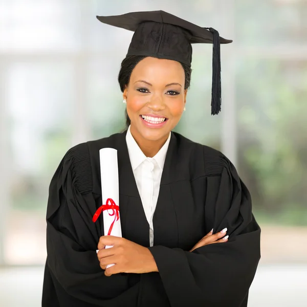 Female african graduate with arms crossed — Stock Photo, Image