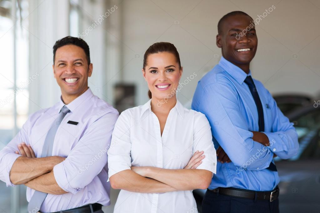 vehicle sales team with arms crossed