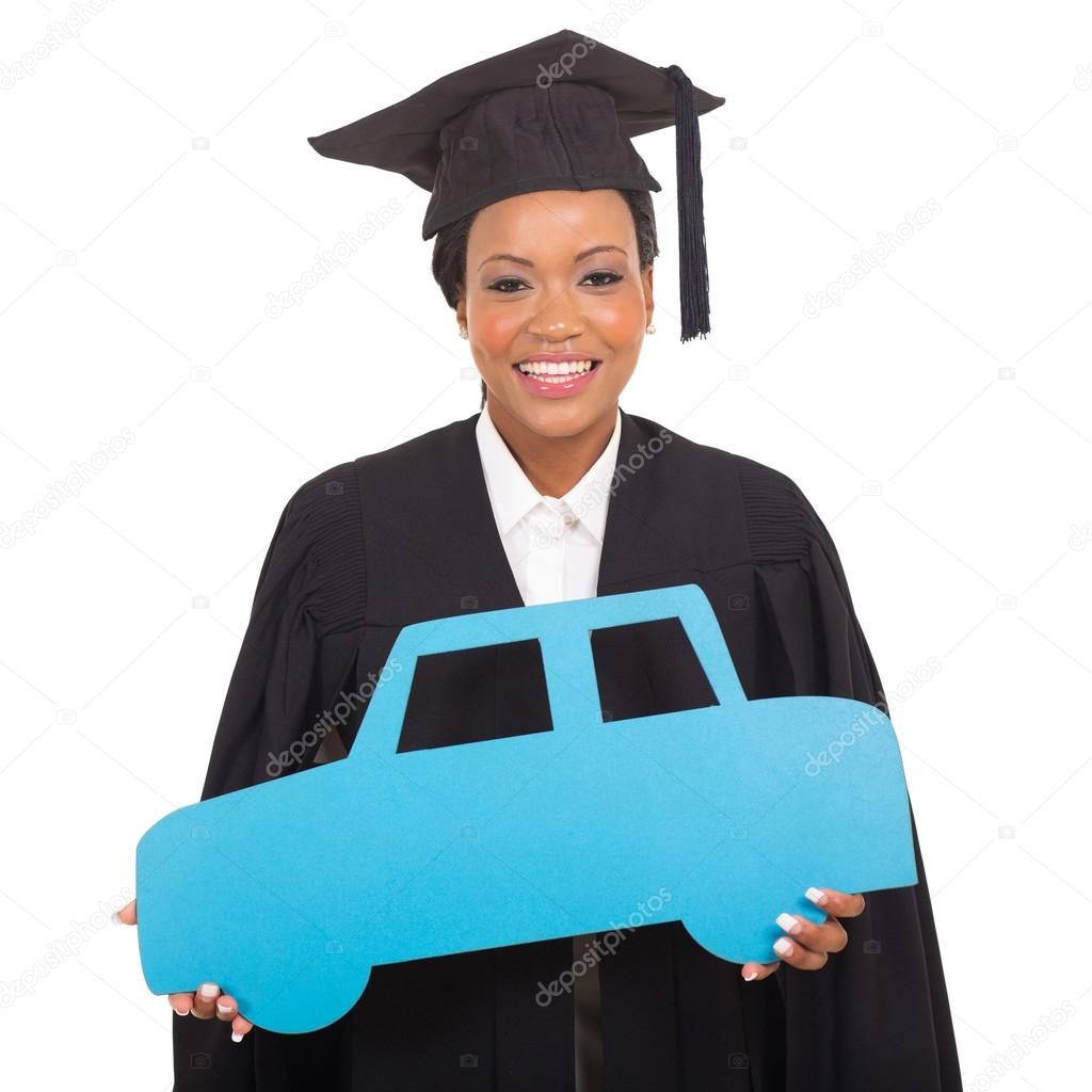Young graduate holding a car symbol