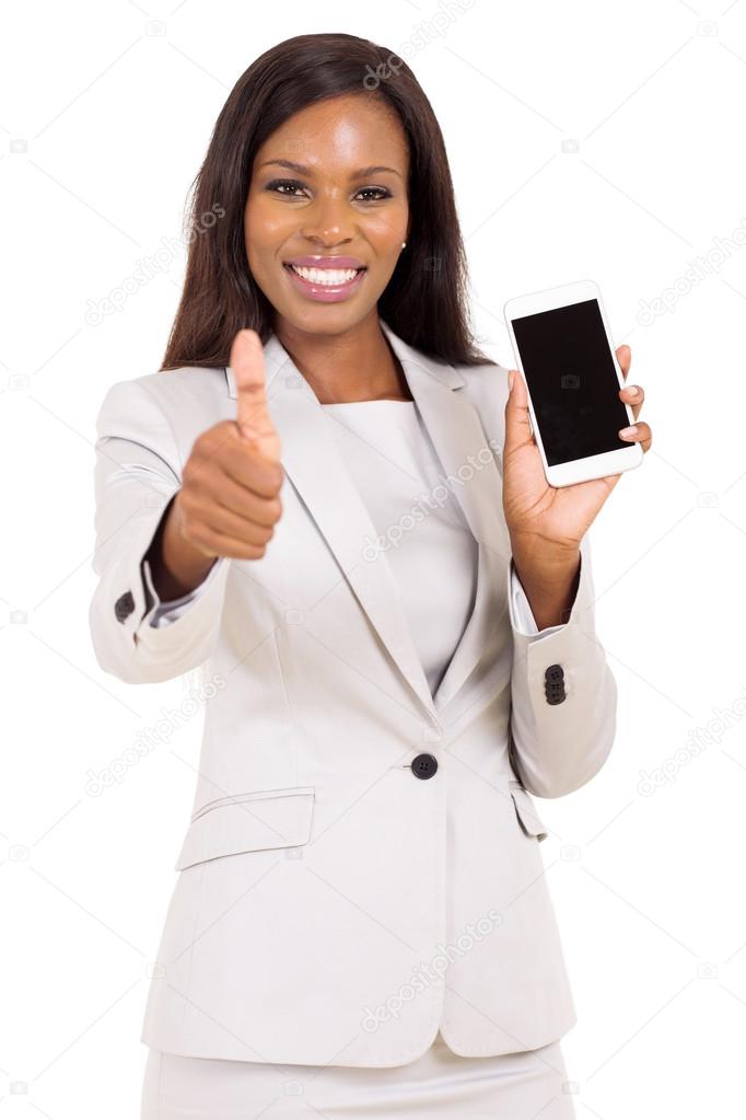 businesswoman holding cell phone and giving thumb up