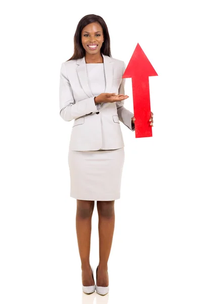 Businesswoman presenting red arrow symbol — Stock Photo, Image