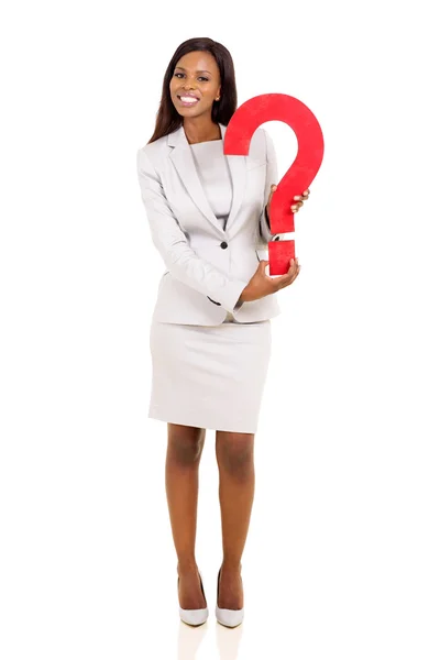 Young businesswoman holding question mark — Stock Photo, Image