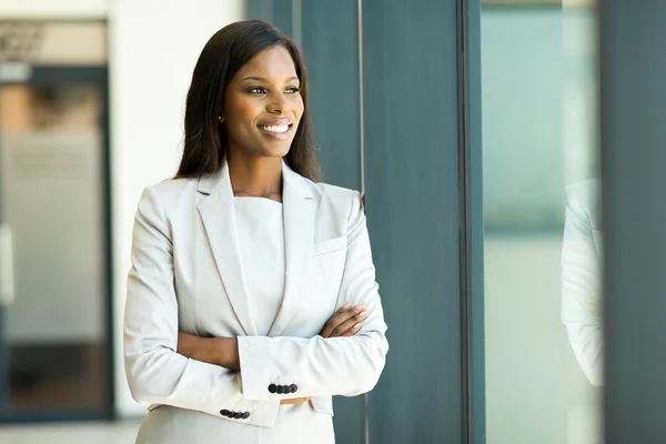 Young businesswoman looking out the window — Stock Photo, Image