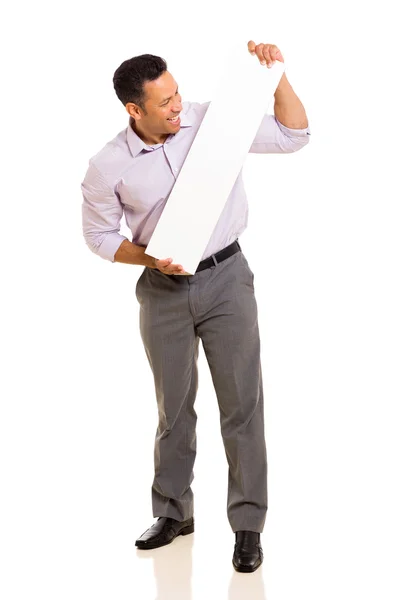 Man looking at blank white board — Stock Photo, Image