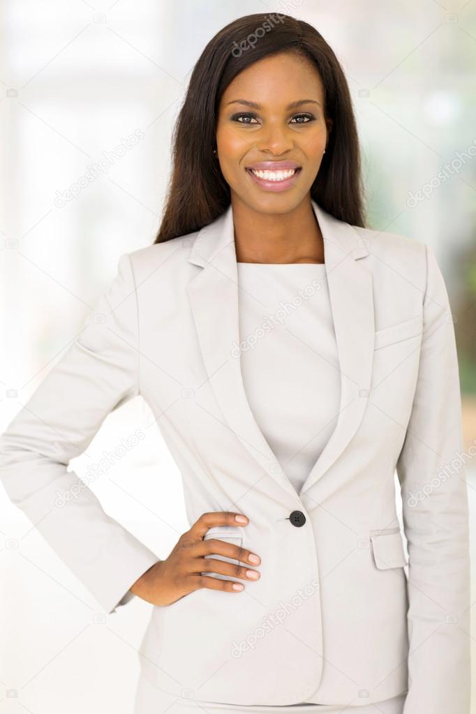 African american businesswoman standing in office Stock Photo by ...
