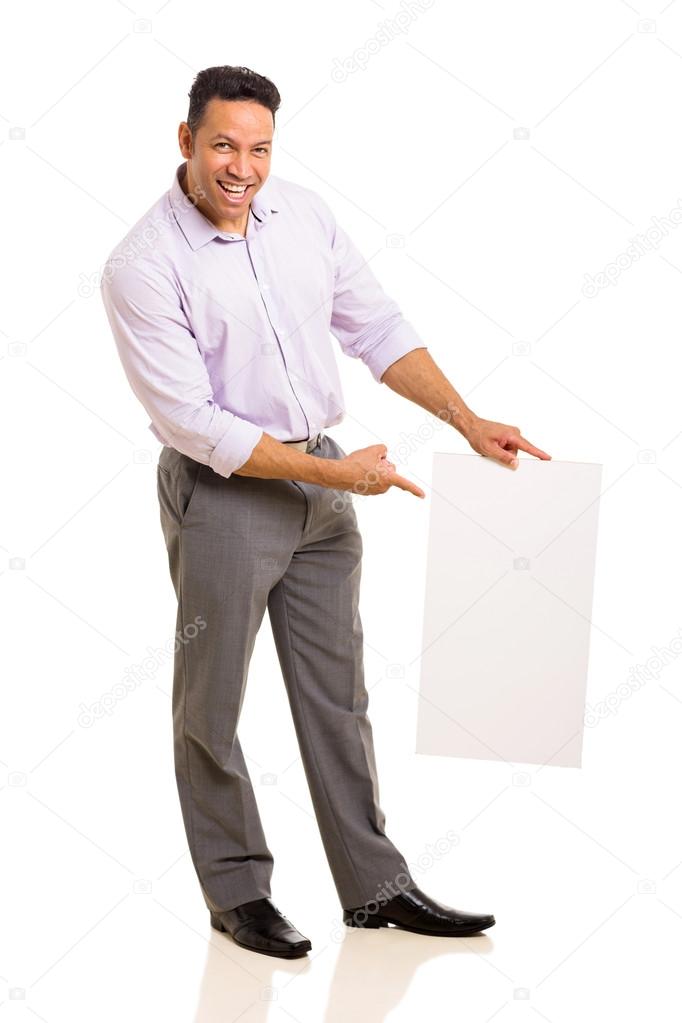 Businessman pointing at blank white board