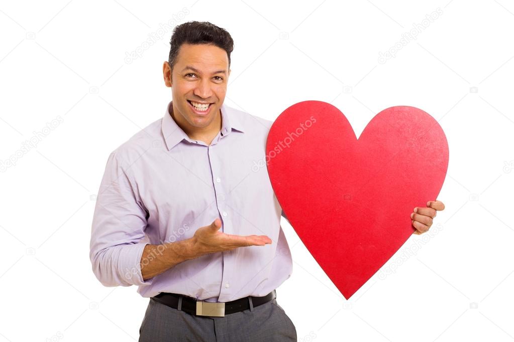 Man presenting red heart shape