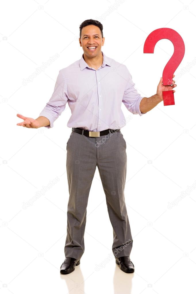 Businessman holding question mark