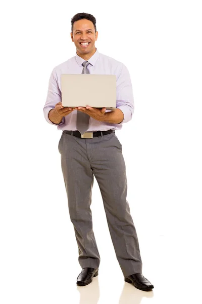 Middle aged businessman holding laptop — Stock Photo, Image