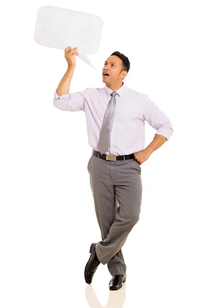 Businessman talking in speech bubble — Stock Photo, Image