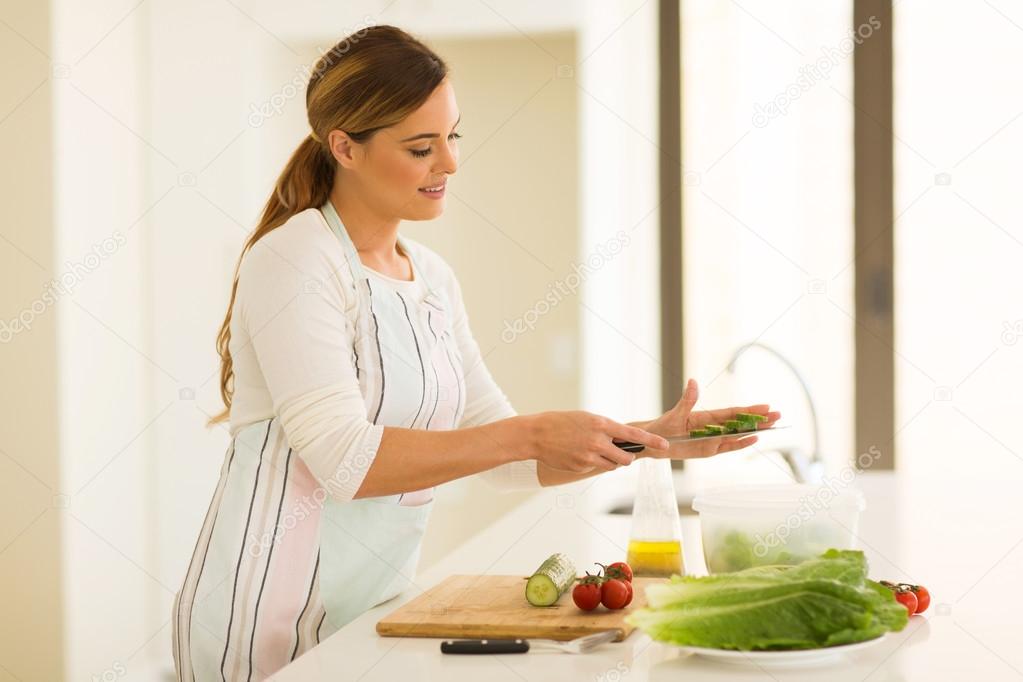 woman making green salad
