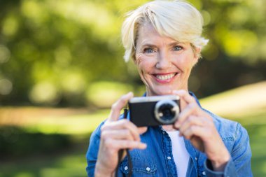 woman with her camera smiling clipart