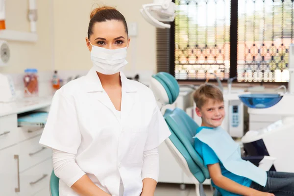 Dentist in office with child — Stok fotoğraf