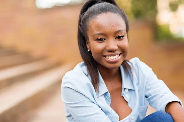 University student sitting outdoors — Stock Photo, Image