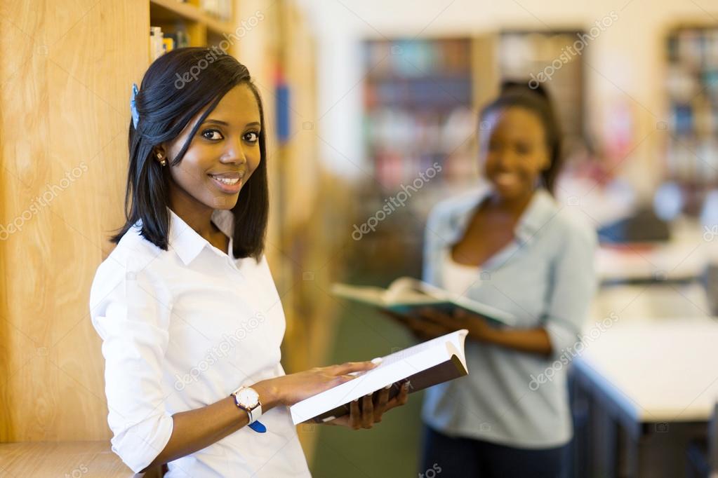 university student in reading a book