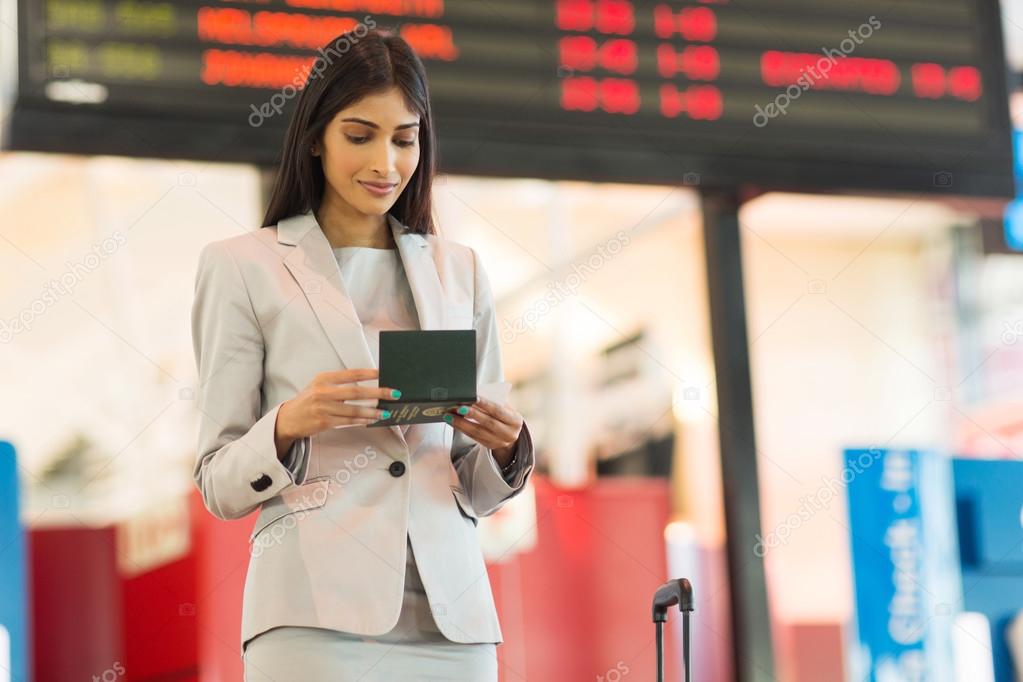 businesswoman looking at air ticket