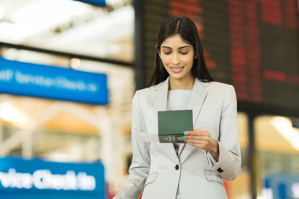 Businesswoman looking at boarding pass — Stock Photo, Image