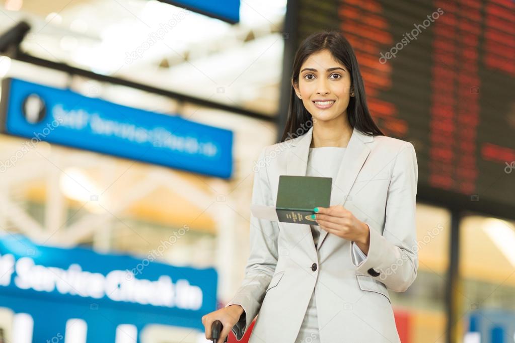 traveller holding passport and boarding pass