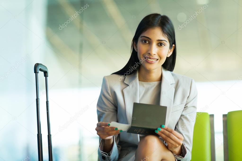 indian woman sitting at airport 