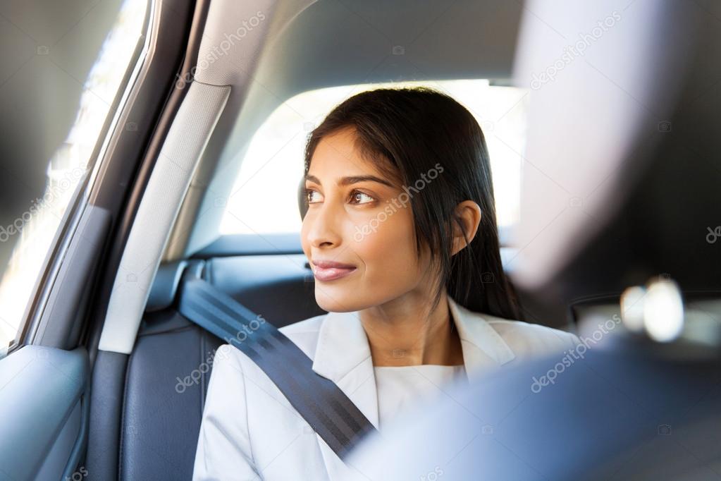 executive looking out of a car window