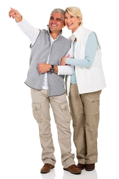 Middle aged couple pointing by hand — Stock Photo, Image