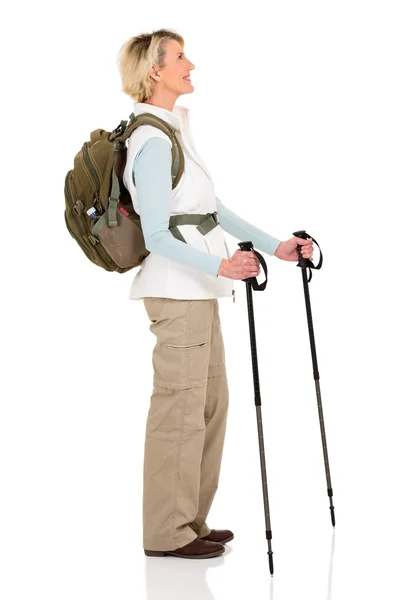 Senior woman with backpack and hiking poles — Stock Photo, Image