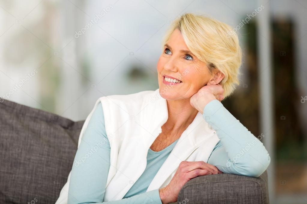 woman daydreaming at home