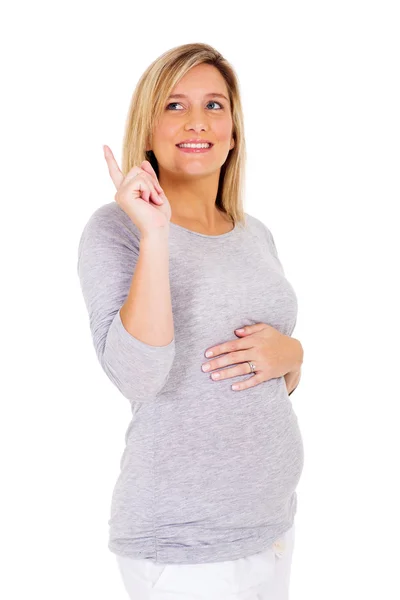 Gravid kvinna pekar uppåt — Stockfoto