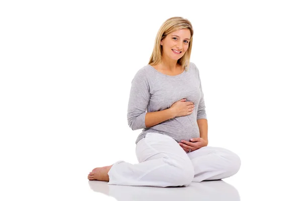 Pregnant woman on floor — Stock Photo, Image