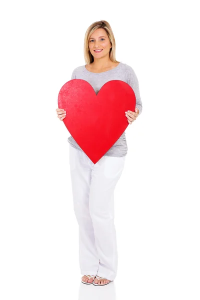Young pregnant woman holding heart shape — Stock Photo, Image