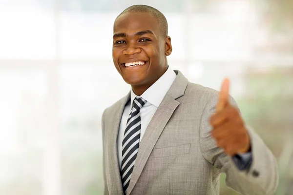 Business executive giving thumb up Stock Photo