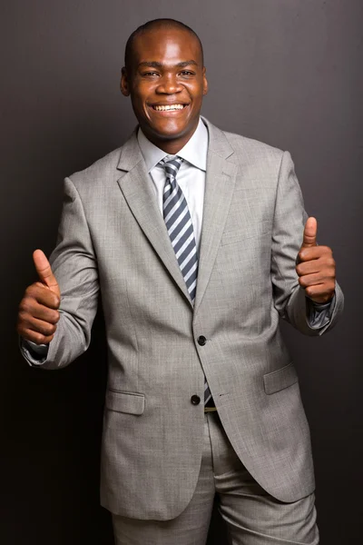 Businessman giving thumbs up — Stock Photo, Image