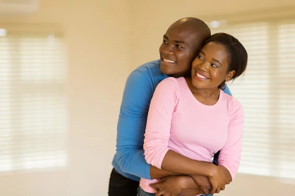 Couple embracing in home — Stock Photo, Image